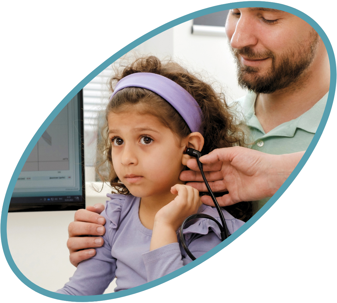 Child doing hearing test with dad